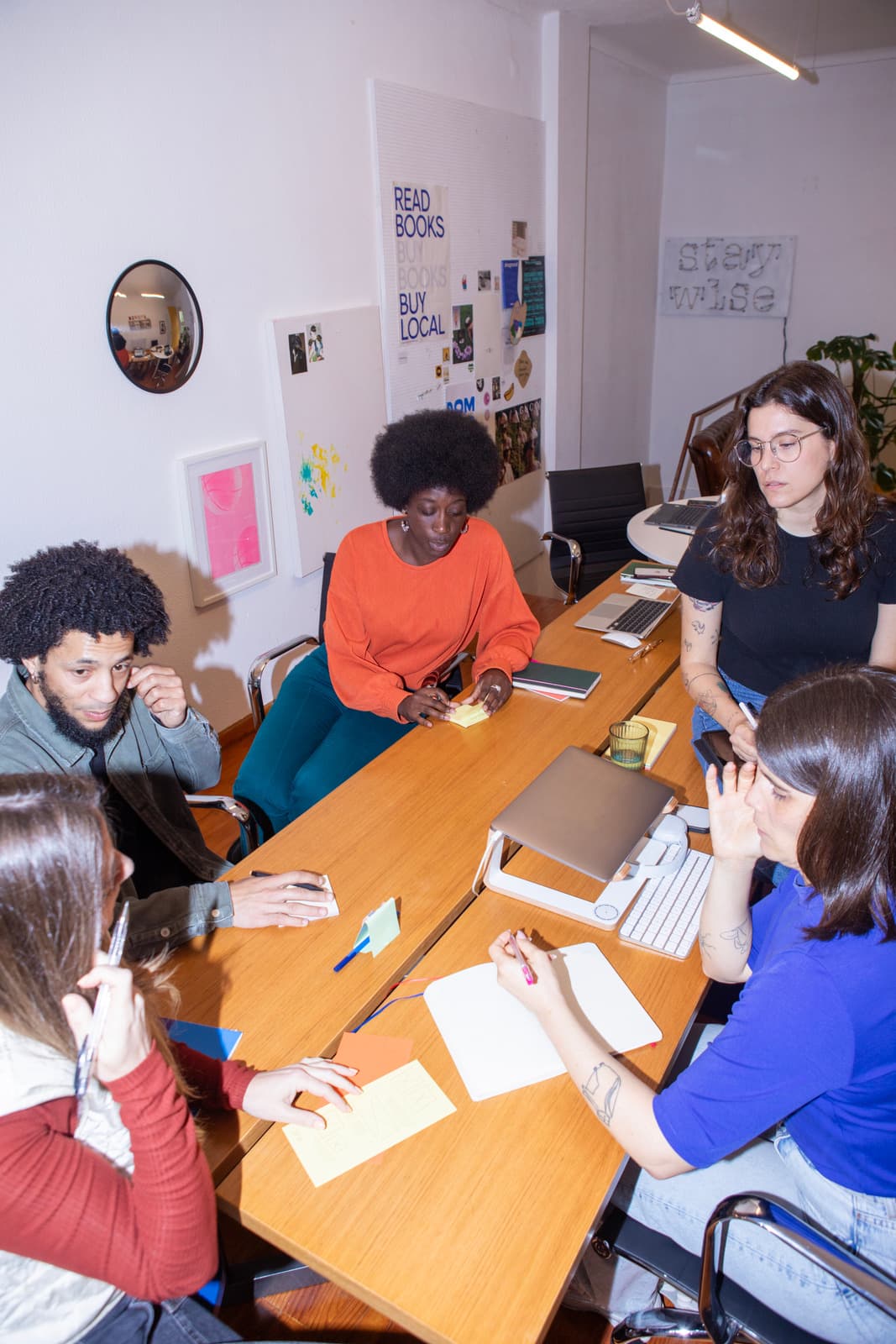 Group of people collaborating around a table